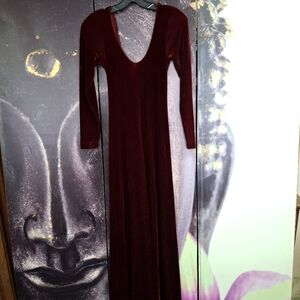 90's maxi dress is low-cut front and back. Color is Wine/burgundy.Form fitting.